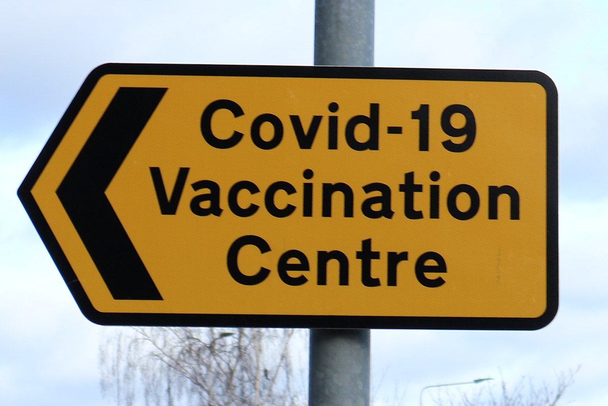 1200px-Covid-19_Vaccination_Centre_sign_